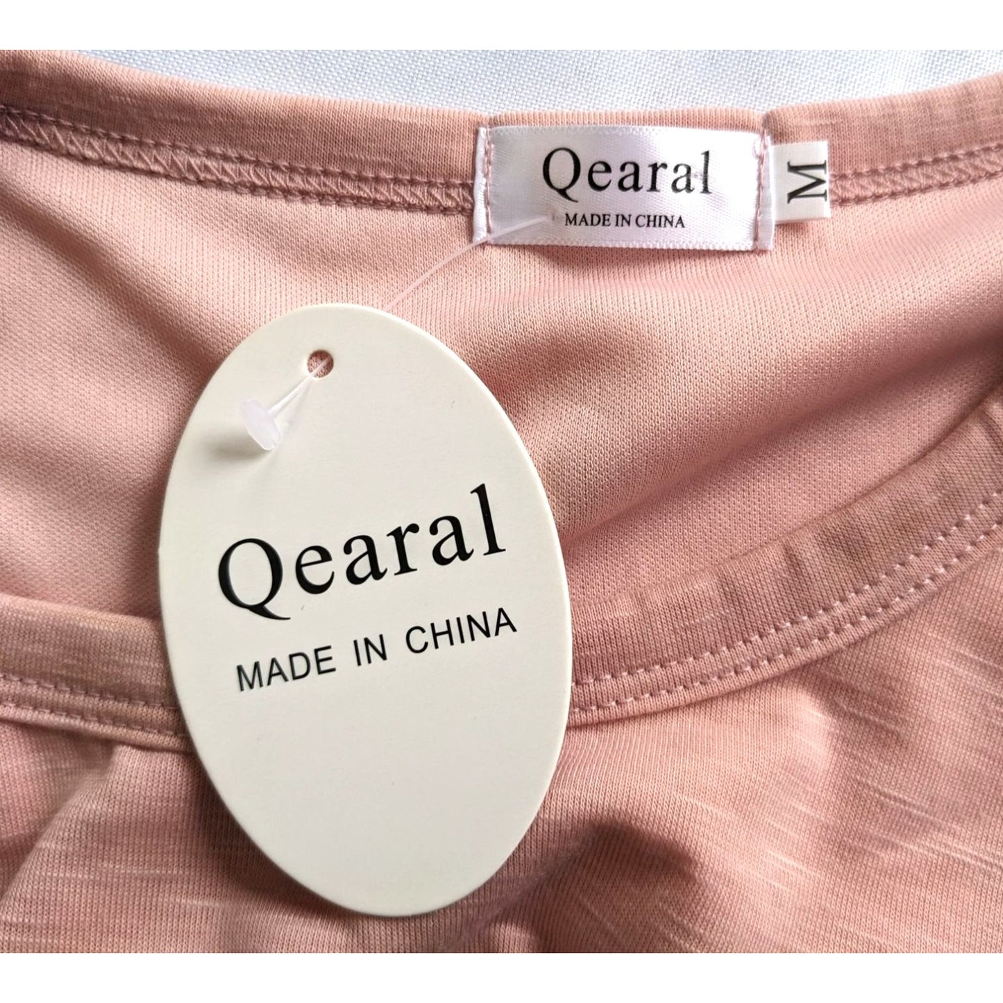 NWT QEARAL Spring Peach Bodycon T-Shirt Mini Dress Ruched Side Tulip Hem Size M